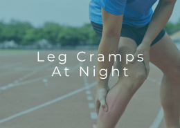 Person experiencing painful calf muscle cramp in the leg at night