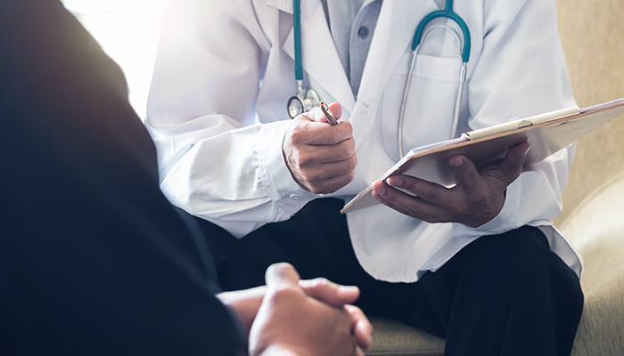 vascular specialist evaluating patient during medical consultation